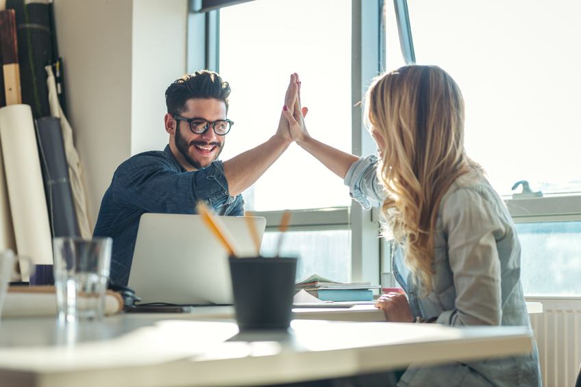 Woman and man high five